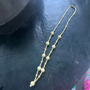 Ivory colored vintage carved bone necklace.